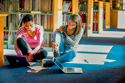 Students sitting in a library