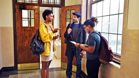 Students in a hallway talking